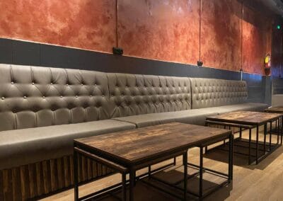 Three Monkeys Cannabis Club lounge room with sofas