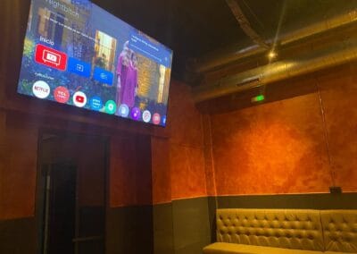 Watching TV at Three Monkeys Cannabis Club